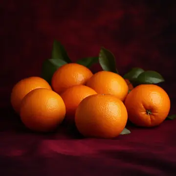A pile of mandarins with leaves