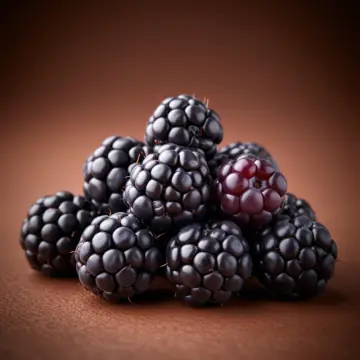 A pile of dark boysenberries