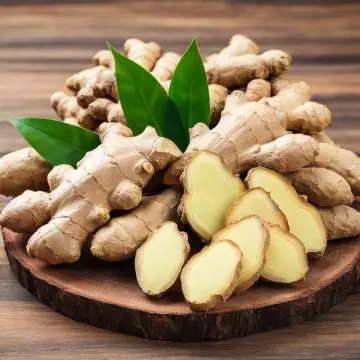 Fresh ginger root, whole and sliced