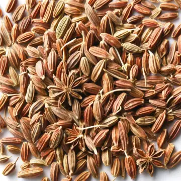 A heap of small seeds with star anise