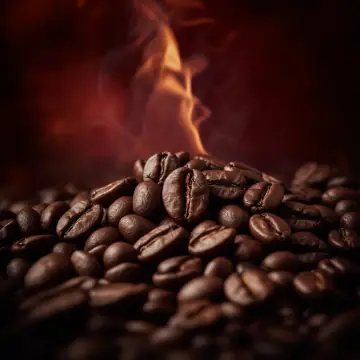 Roasted coffee beans with a wisp of steam