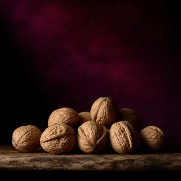 A pile of walnuts in their shells